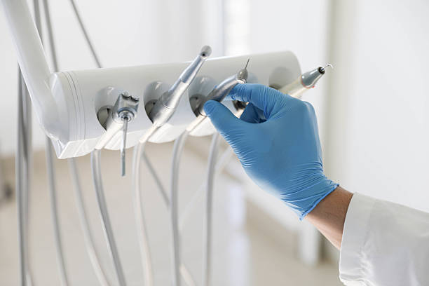 Professional Tooth Extraction technician working in Keene, NH